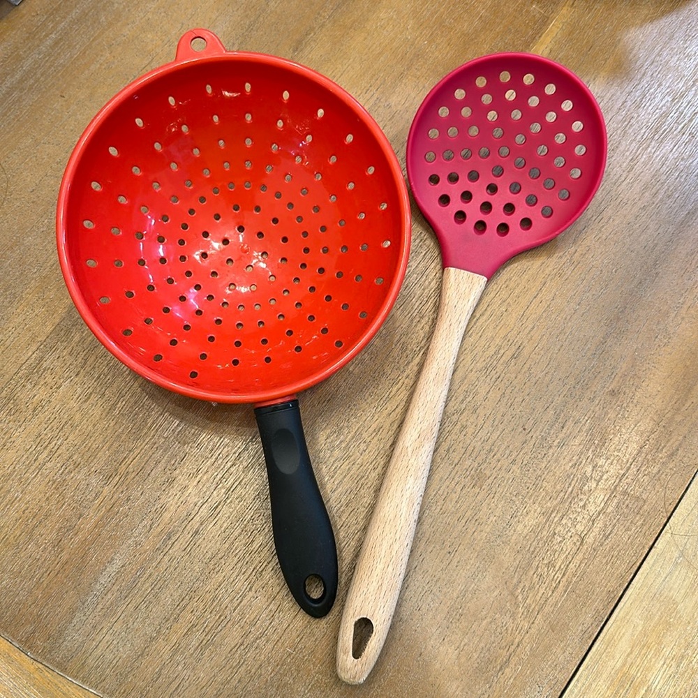 Two colander strainer kitchen tools.